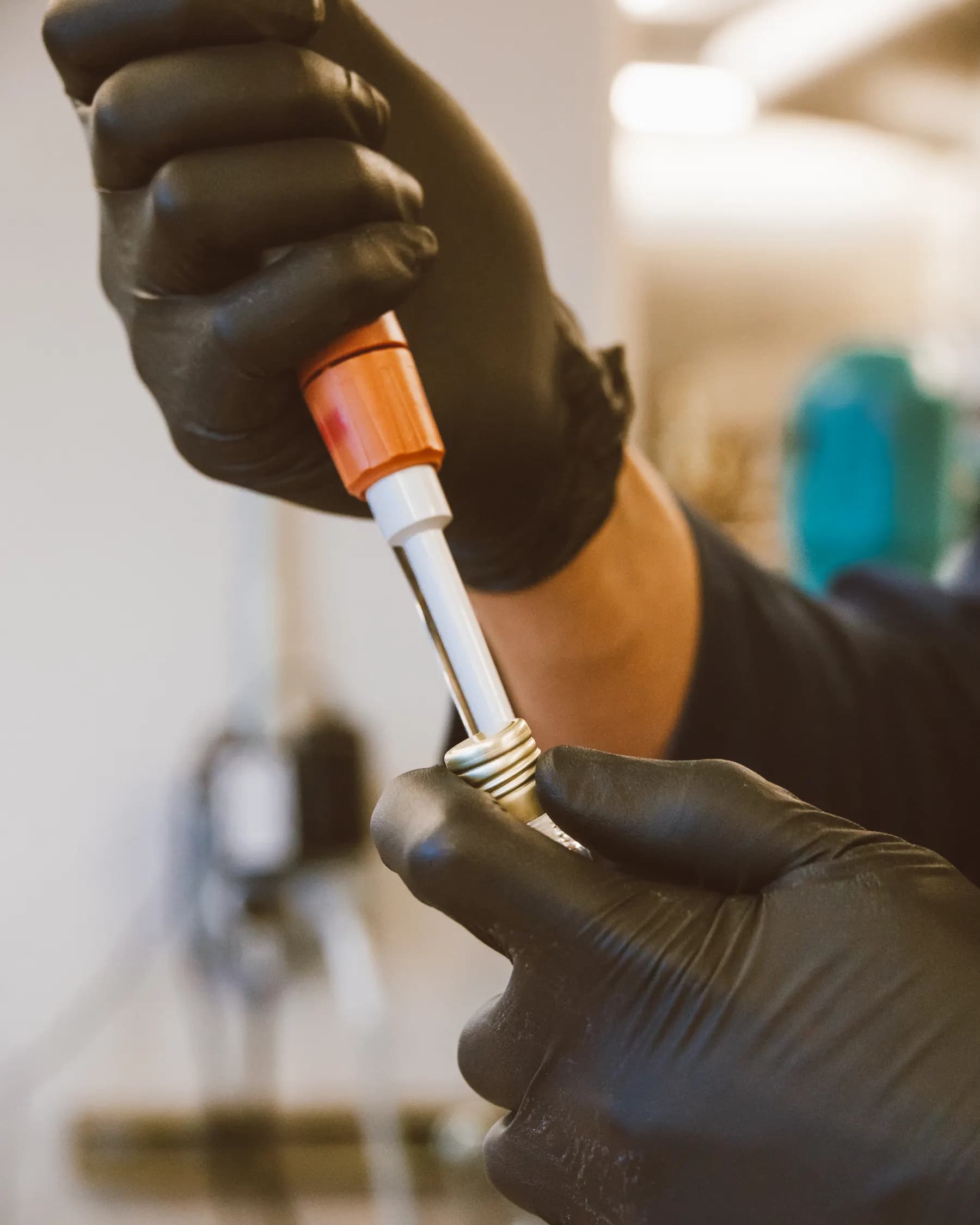 A person using a pipette at a real laboratory bench